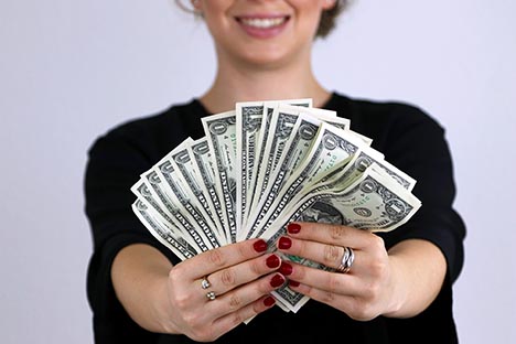 Woman holding a lot of money