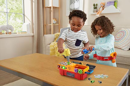 Children playing with toys on a table